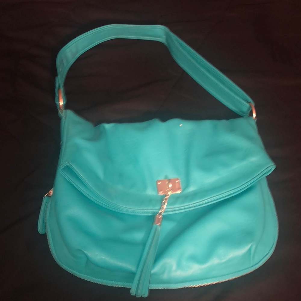 Used Purse color Aqua in ok condition